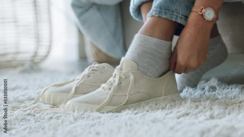 Picture of Woman, bed and tie shoelace together on bedroom floor carpet to get ...
