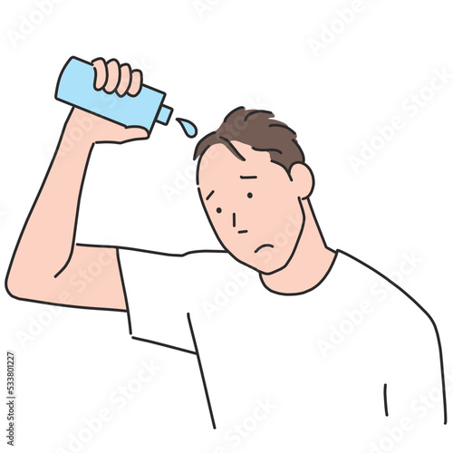 不安な顔で育毛剤を使う薄毛の男性