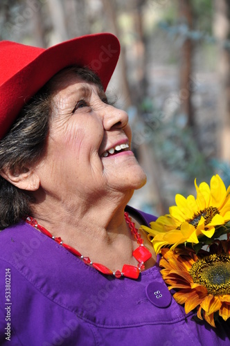 Portrait of  beautiful happy latina old woman photo