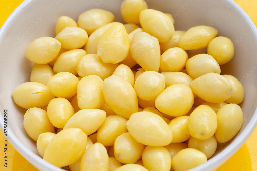 Boiled ginkgo nuts on yellow background. Boiled ginkgo nuts on yellow background.