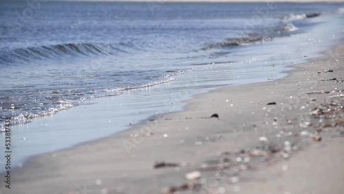 Waves in the sandy beach, close-up, slow motion 2