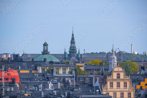 Roof tops with dorms and towers of the old town Gamla Stan an autumn day in Stockholm