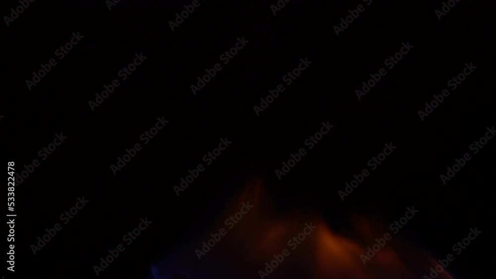4K burning power of the flame, Flames and burning sparks close-up, fire patterns, the glow of fire in the dark 4K burning power of the flame, Flames and burning sparks close-up, fire patterns, the glow of fire in the dark
