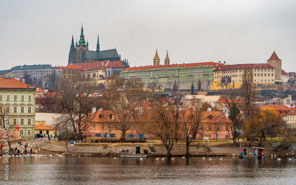 Obraz premium Beautiful view of Prague , Historic and romantic old town along Vltava River near Charles bridge during winter . Prague , Czech : December 12 , 2019
