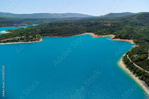 Aerial view on blue lake Sainte-Croix-du-Verdon and villages on cliffs, tourists destination in France