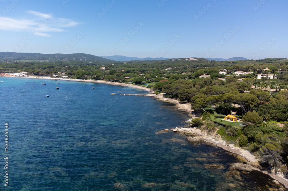 Aerial view of legendary Pampelonne beach near Saint-Tropez, summer vacation on white sandy beaches of French Riviera, France