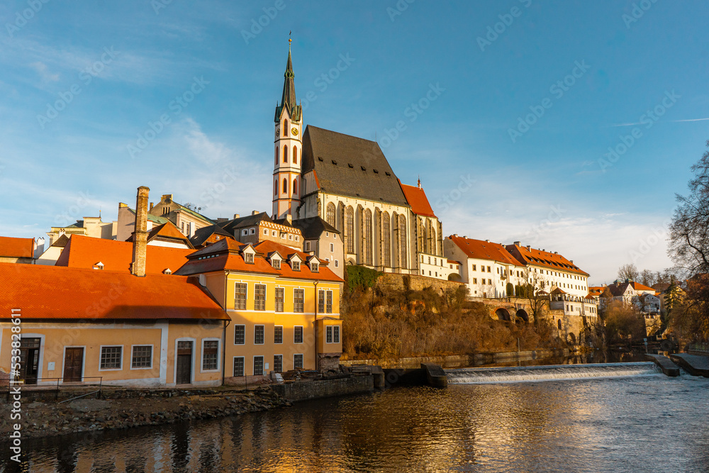 Beautiful view and Church of St.Vitus along Vltava River in Cesky Krumlov , medieval and romantic town during winter. Cesky Krumlov , Czech  : December 15, 2019