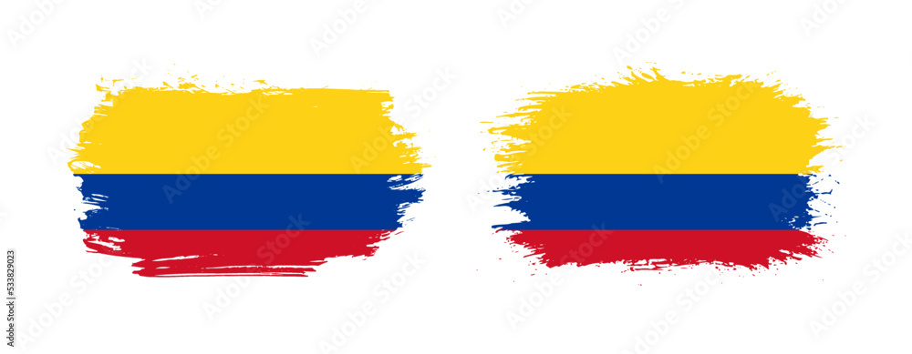 Fototapeta premium Set of two grunge brush flag of Colombia on solid background