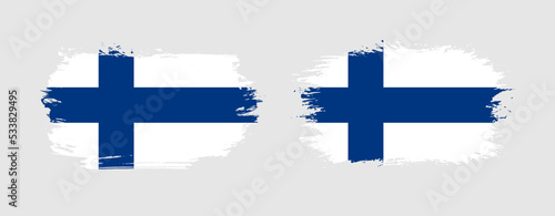 Set of two grunge brush flag of Finland on solid background