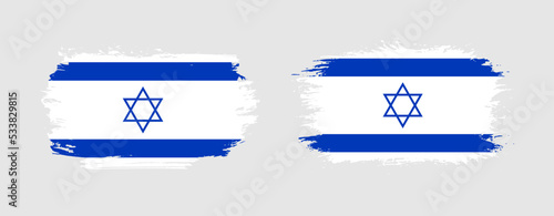 Set of two grunge brush flag of Israel on solid background