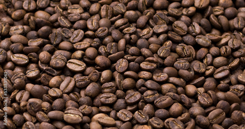 Texture roasted coffee beans close up toasted brown Texture roasted coffee beans close up toasted brown