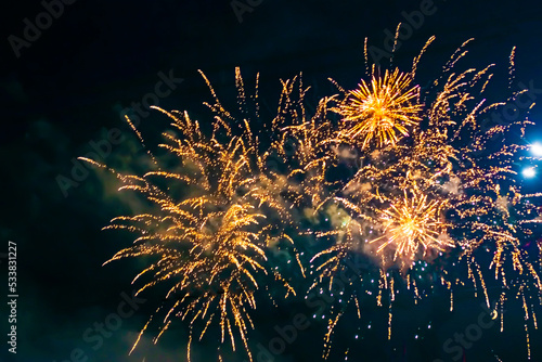 Fireworks above a street lamp, against the background of the night sky. photo