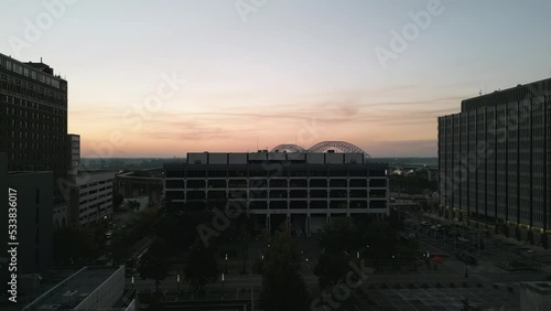 Drone Flying during Sunset around Buildings in Downtown Memphis, Tennessee with the Mississippi River Bridge in the background.