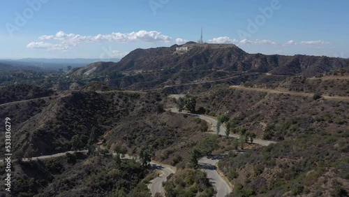 Aerial flying toward the iconic Hollywood sign. Los Angeles, California USA - September 2022.
