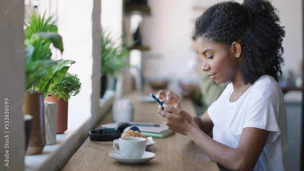 Black woman, student and phone typing in cafe for planning, reading notification and creative freelancer work. Young african female online social media apps, wifi tech and study break in coffee shop Black woman, student and phone typing in cafe for planning, reading notification and creative freelancer work. Young african female online social media apps, wifi tech and study break in coffee shop