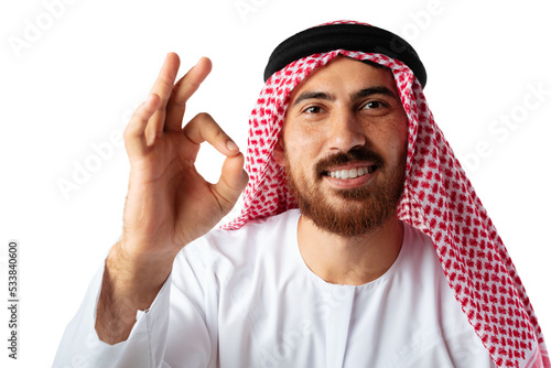 Young Arab man showing ok sign and smiling isolated on white background photo