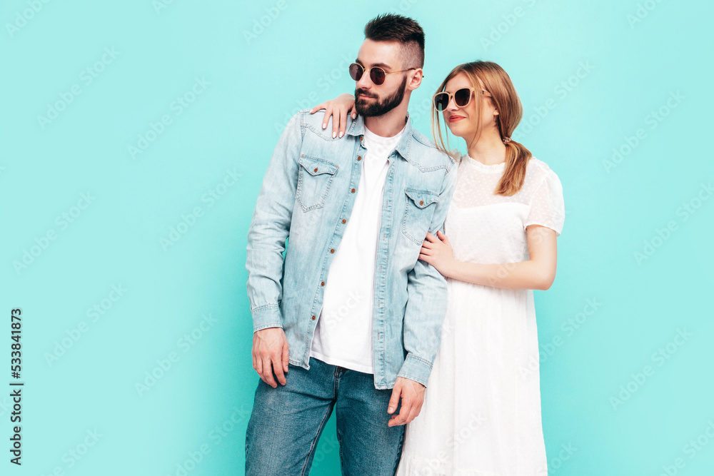 smiling beautiful woman and her handsome boyfriend. Happy cheerful family having tender moments near wall in studio. Pure cheerful models hugging. Embracing each other. Cheerful and happy smiling beautiful woman and her handsome boyfriend. Happy cheerful family having tender moments near wall in studio. Pure cheerful models hugging. Embracing each other. Cheerful and happy