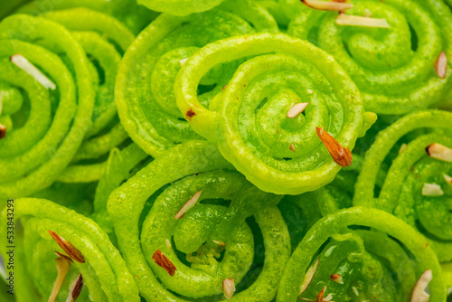 Green Jalebi mithai or sweet from India, a Twist to a traditional imarti or jilbi © StockImageFactory