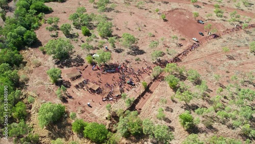 Drone view of people arriving at the cermony site at the end of the Freedom Day Festival march in the remote community of Kalkaringi, Northern Territory, Australia. 26 August 2022. photo