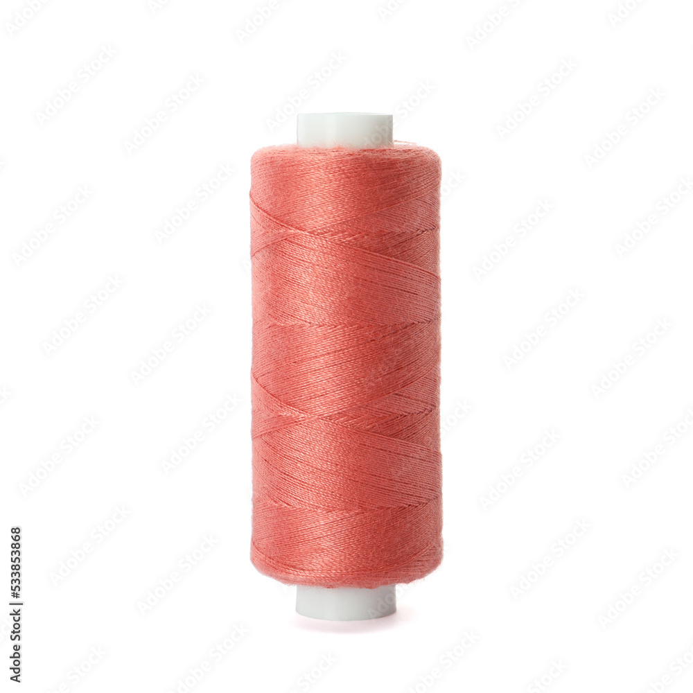 Spool of coral sewing thread isolated on white Spool of coral sewing thread isolated on white