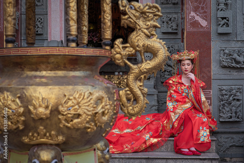 Portrait asian woman wearing traditional Chinese dress cheongsam for Chinese New Year