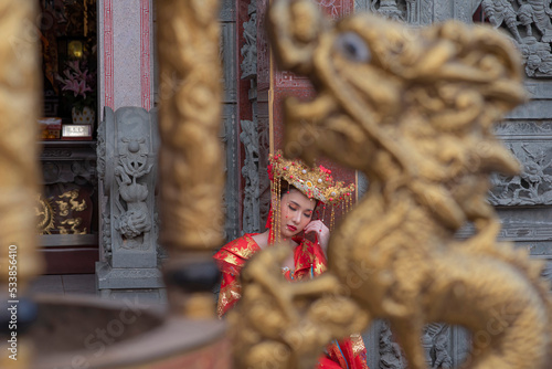 Portrait asian woman wearing traditional Chinese dress cheongsam for Chinese New Year