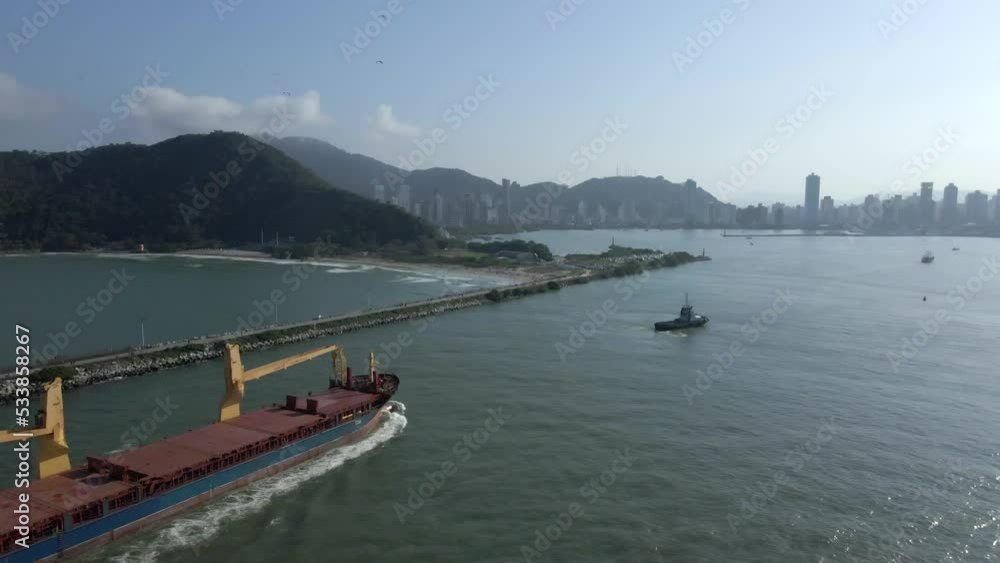 Industrial Barge And Tugboats Enters The Itajai-Acu River To The Shipping Terminal In Navegantes, Santa Catarina, Brazil. - aerial Industrial Barge And Tugboats Enters The Itajai-Acu River To The Shipping Terminal In Navegantes, Santa Catarina, Brazil. - aerial