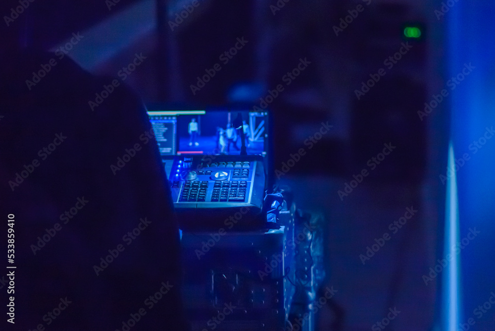 Video switcher of Television Broadcast controls dark blue room for director professional technology high performance.Copy space.Selective focus. Video switcher of Television Broadcast controls dark blue room for director professional technology high performance.Copy space.Selective focus.