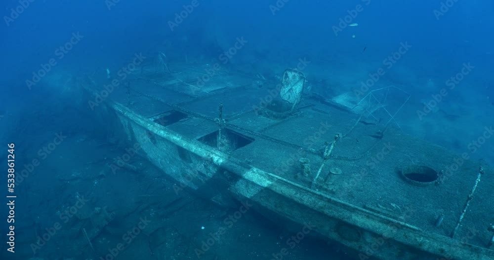 wreck underwater shipwreck on seabed sea floor standing metal on ocean floor some fish around wreck underwater shipwreck on seabed sea floor standing metal on ocean floor some fish around