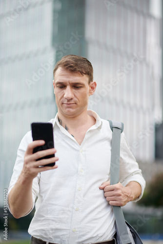 Businessman Reading Confusing Text Message