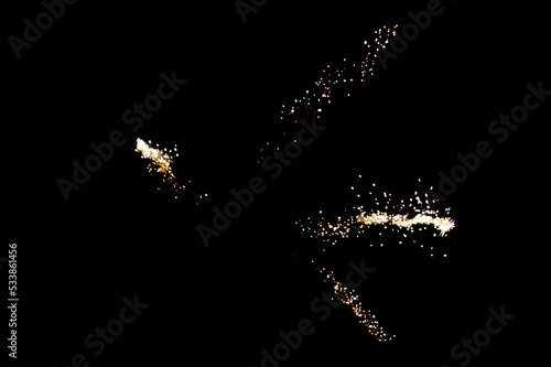 effect of the overlay of rays from salute on a black background, flash and sparkles.