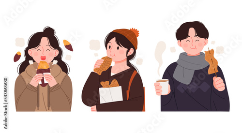 People eating Korean street food. Bungeoppang, fish cake skewers, and roasted sweet potatoes.