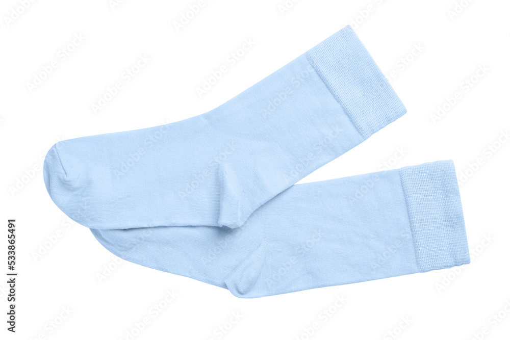 Pair of light blue socks on white background, top view