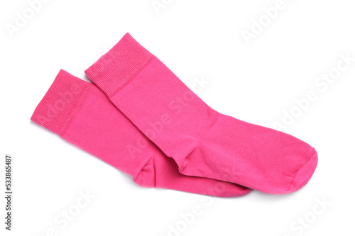 Pair of pink socks on white background, top view