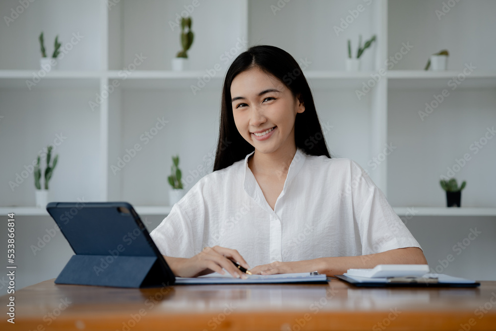 Portrait of a young beautiful Asian woman in a office room, concept image of Asian business woman, modern female executive, startup business woman, business leader woman. Portrait of a young beautiful Asian woman in a office room, concept image of Asian business woman, modern female executive, startup business woman, business leader woman.