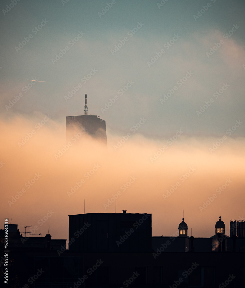 foggy sunrise in the city