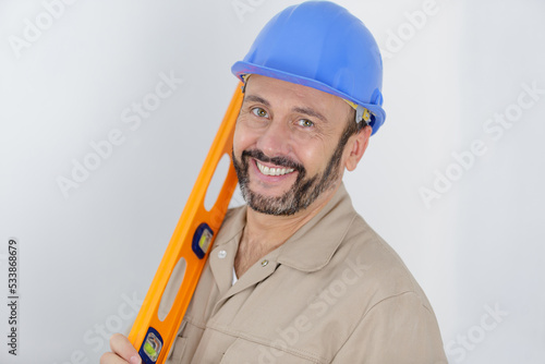 portrait of builder with spirit level