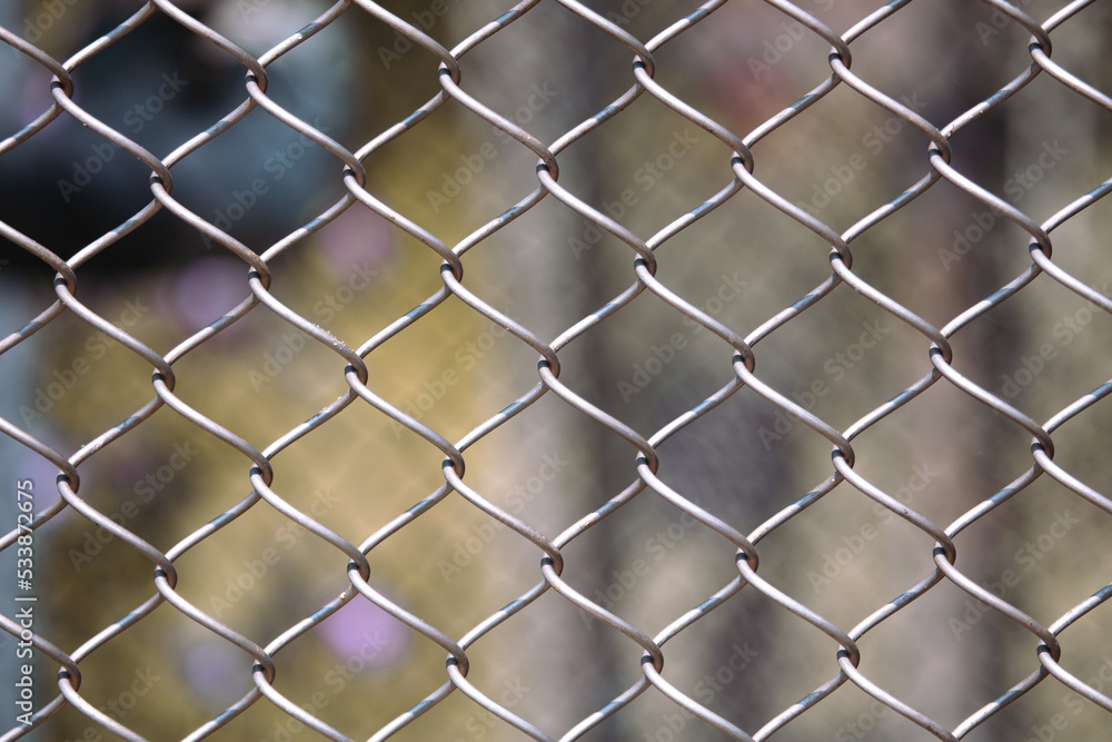 Metal mesh on the fence as a background. Metal mesh on the fence as a background.