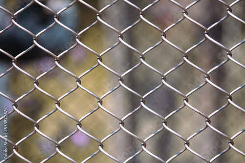 Metal mesh on the fence as a background.