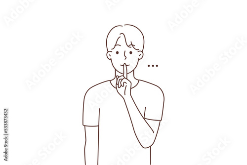 Man holding finger at lips ask for silence