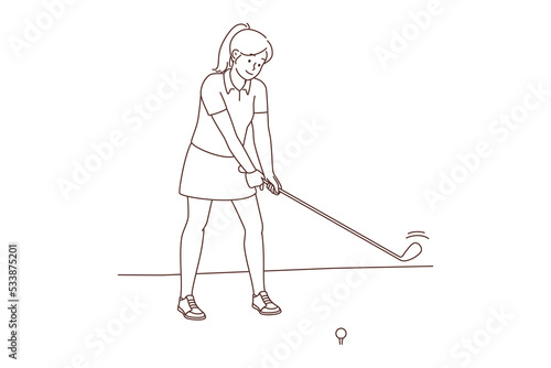 Woman playing golf on field