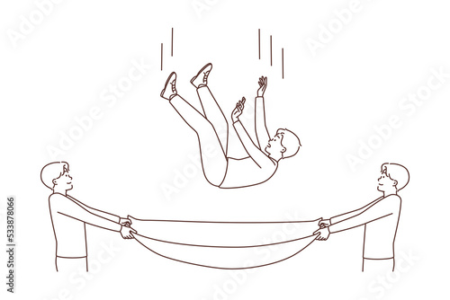 Men with cloth saving guy from falling