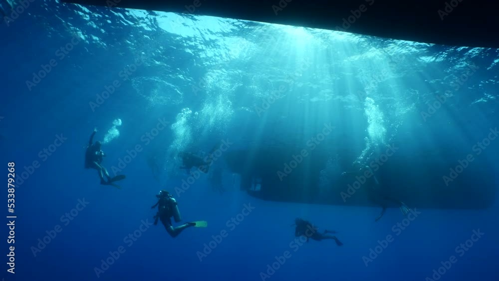 scuba divers around the boat for diving underwater scenery ocean scuba divers around the boat for diving underwater scenery ocean