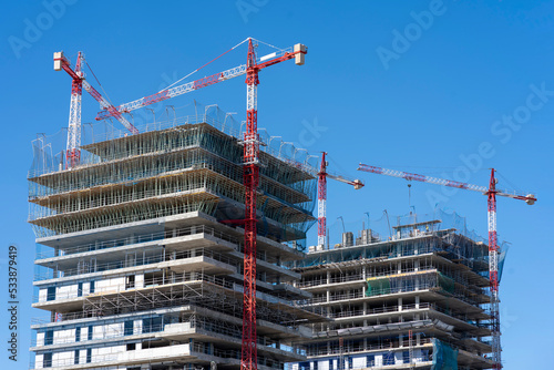 Crane and building construction site for city expansion.