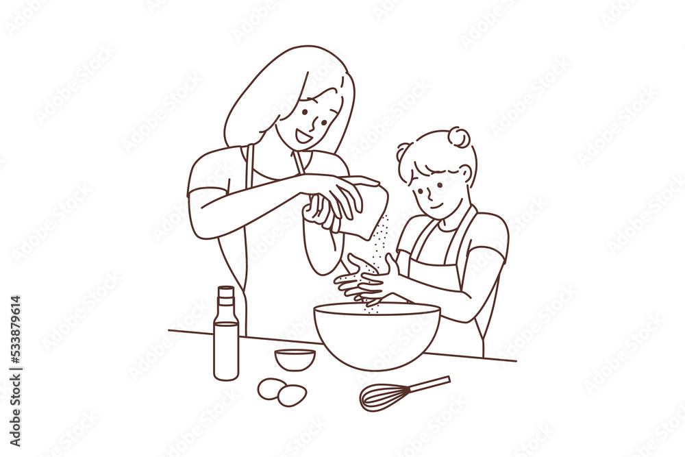 Happy mother and daughter cooking together 