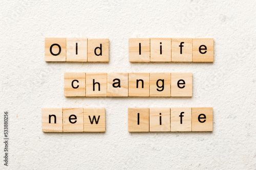 old life change new life word written on wood block. old life change new life text on table, concept
