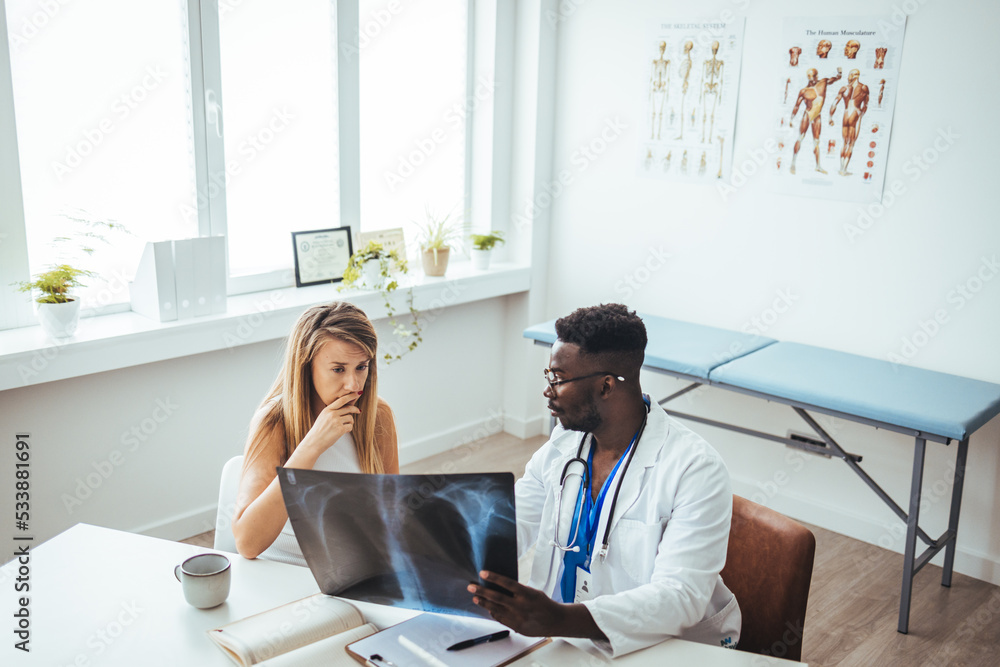 The doctor is analyzing and clarifying images of the patient's lung X
