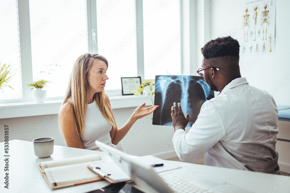 The doctor is analyzing and clarifying images of the patient's lung X