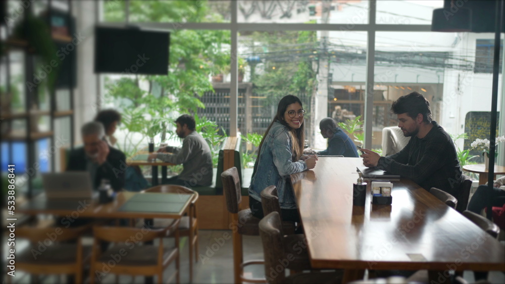 Interior of coffee shop place with people. Cafe restaurant with men and women inside Interior of coffee shop place with people. Cafe restaurant with men and women inside
