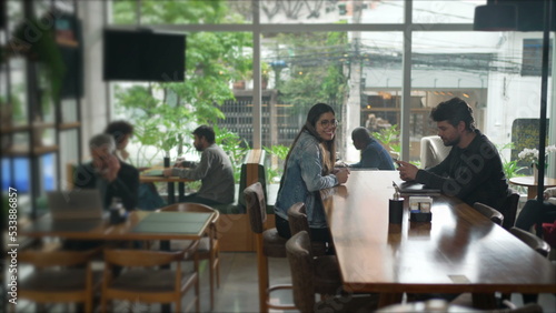 Interior of coffee shop place with people. Cafe restaurant with men and women inside